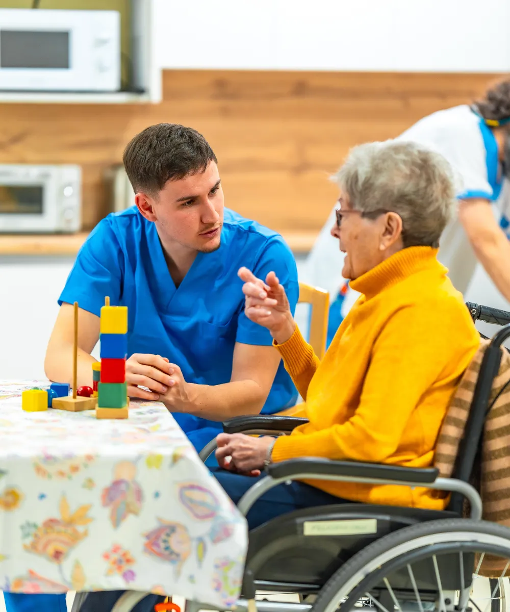 LeadGulls PPC specialists reviewing a senior living community Google Ads and Facebook Ads campaign on a monitor showing inquiry volume data